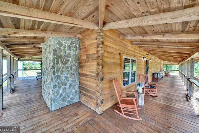 wooden terrace with a porch