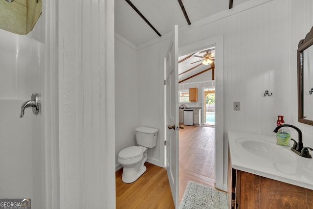 bathroom with vanity, ceiling fan, wood-type flooring, toilet, and lofted ceiling