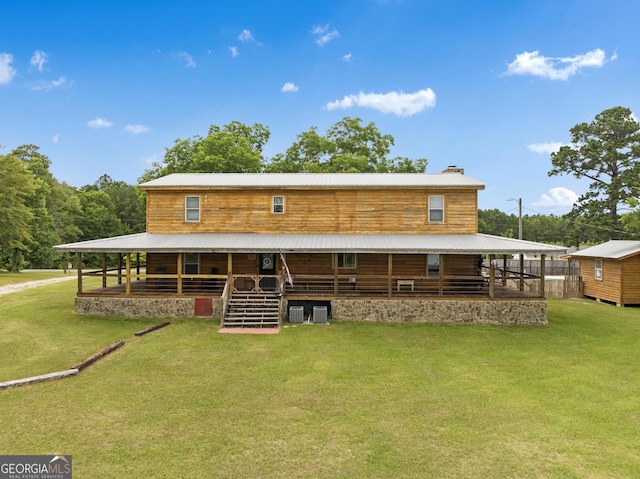 back of property with an outdoor structure