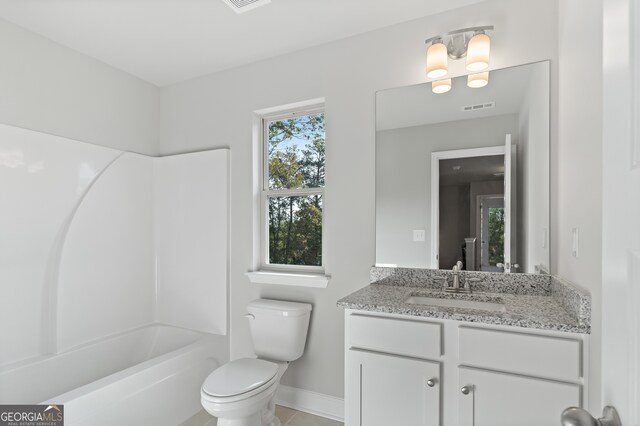 full bathroom featuring tile patterned flooring, washtub / shower combination, vanity, and toilet