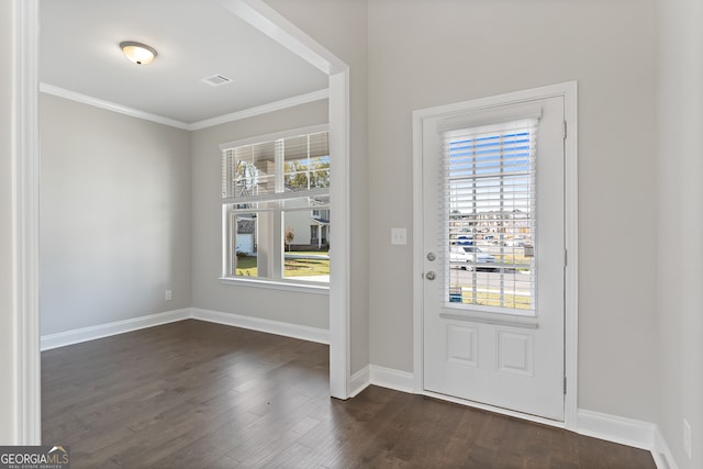 foyer with ornamental molding and dark wood-type flooring