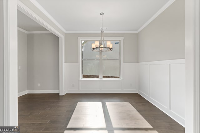 unfurnished dining area featuring a notable chandelier, dark wood-type flooring, and crown molding