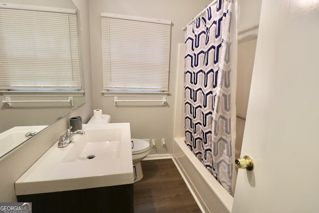 full bathroom featuring shower / tub combo, vanity, toilet, and wood-type flooring