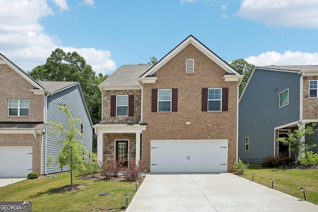 view of front of home featuring a front lawn and a garage