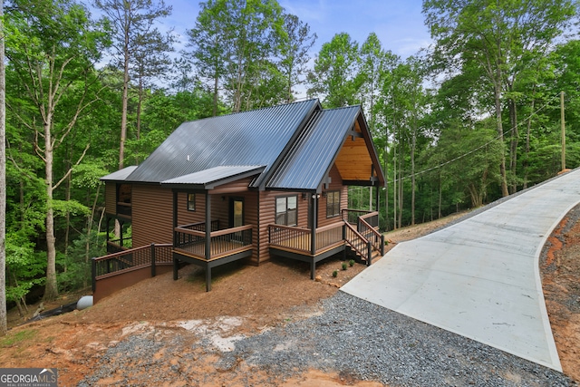 log-style house featuring a porch