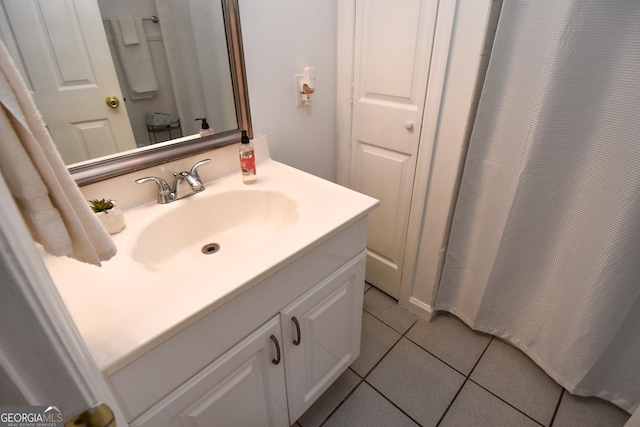 bathroom with tile patterned flooring and vanity