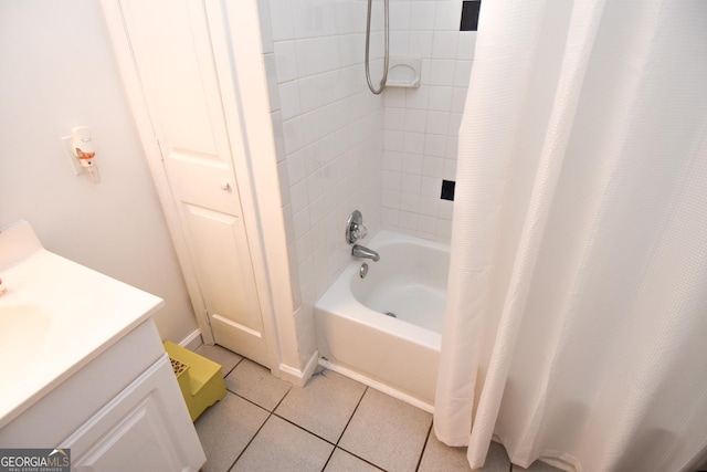 bathroom with shower / bath combo, vanity, and tile patterned flooring