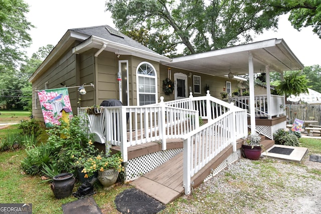 exterior space featuring a shingled roof