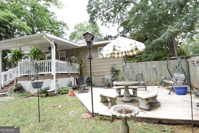 back of property featuring a patio and a fenced backyard