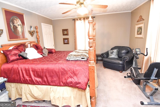 carpeted bedroom with a textured ceiling, ceiling fan, and ornamental molding