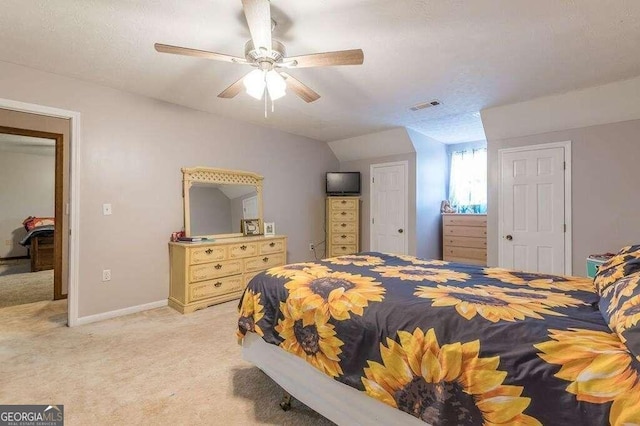 carpeted bedroom with ceiling fan and lofted ceiling