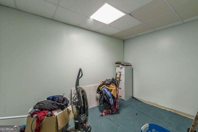 workout area with a paneled ceiling