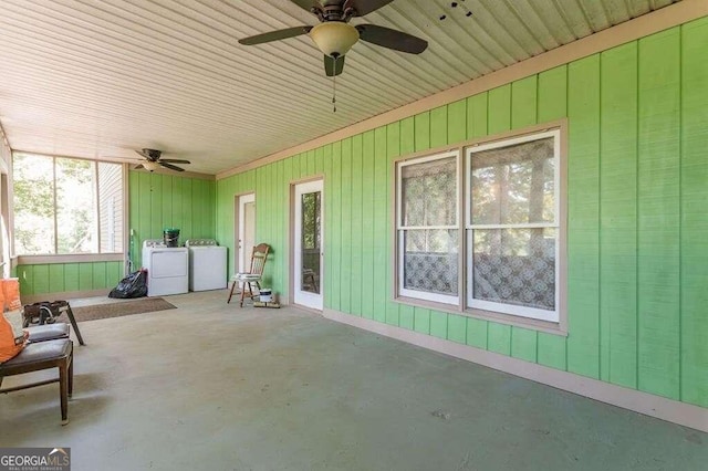 view of patio with separate washer and dryer and ceiling fan