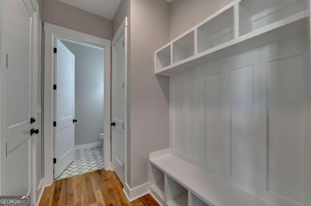 mudroom with light hardwood / wood-style floors