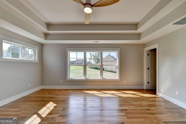 spare room featuring ceiling fan and light hardwood / wood-style flooring