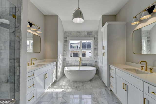 bathroom featuring vanity, separate shower and tub, and tile walls