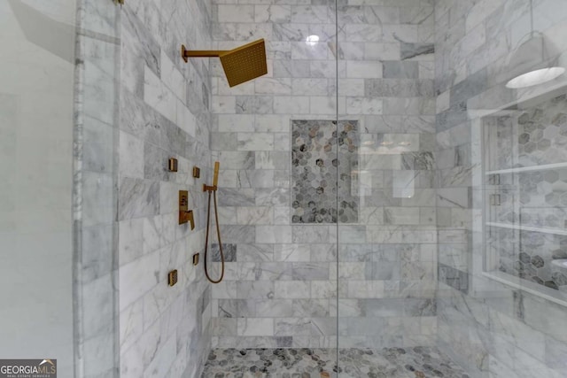 bathroom featuring tiled shower