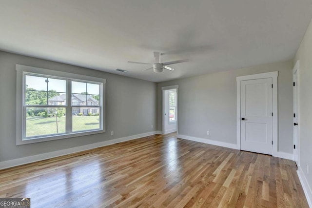 spare room featuring ceiling fan and light wood-type flooring