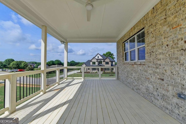 wooden deck with a yard