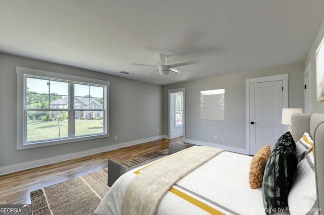 bedroom featuring hardwood / wood-style flooring and ceiling fan