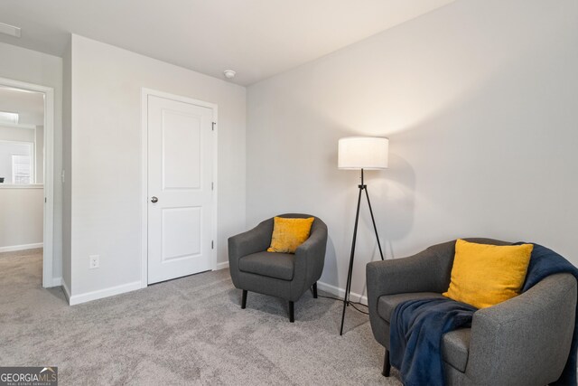 sitting room with light carpet