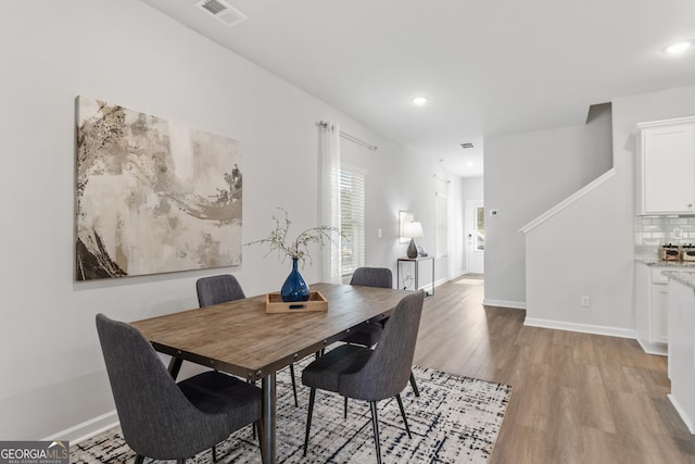 dining space featuring light wood-type flooring