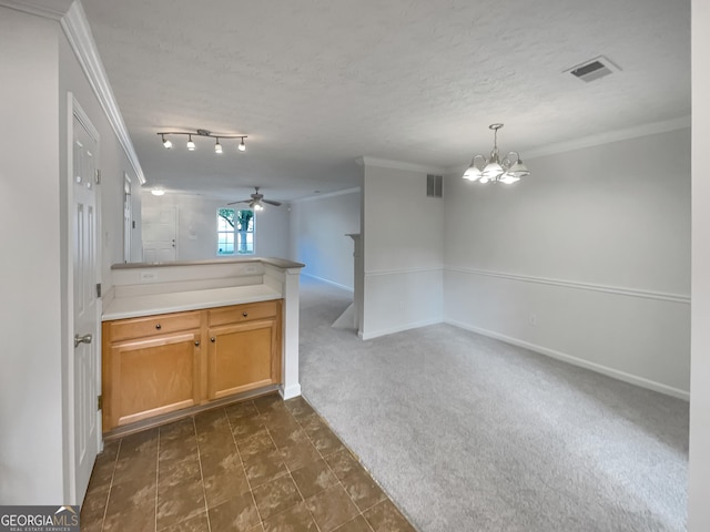6531 Arbor Gate Dr SW # 12, Mableton, GA 30126 - kitchen with dark colored carpet, ceiling fan with notable chandelier, crown molding, a textured ceiling, and kitchen peninsula