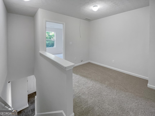 6531 Arbor Gate Dr SW # 12, Mableton, GA 30126 - empty room featuring a textured ceiling and dark carpet