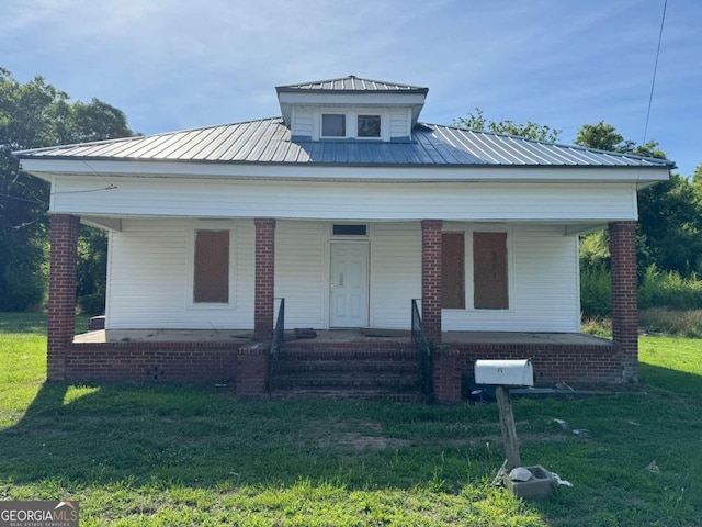 bungalow-style house featuring a front yard and a porch