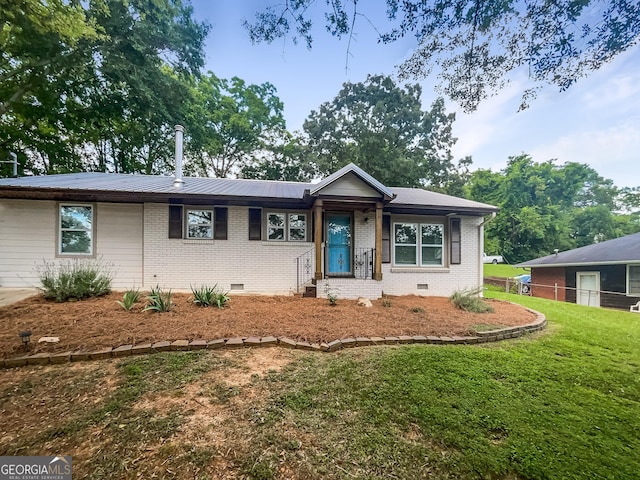 ranch-style house with a front lawn