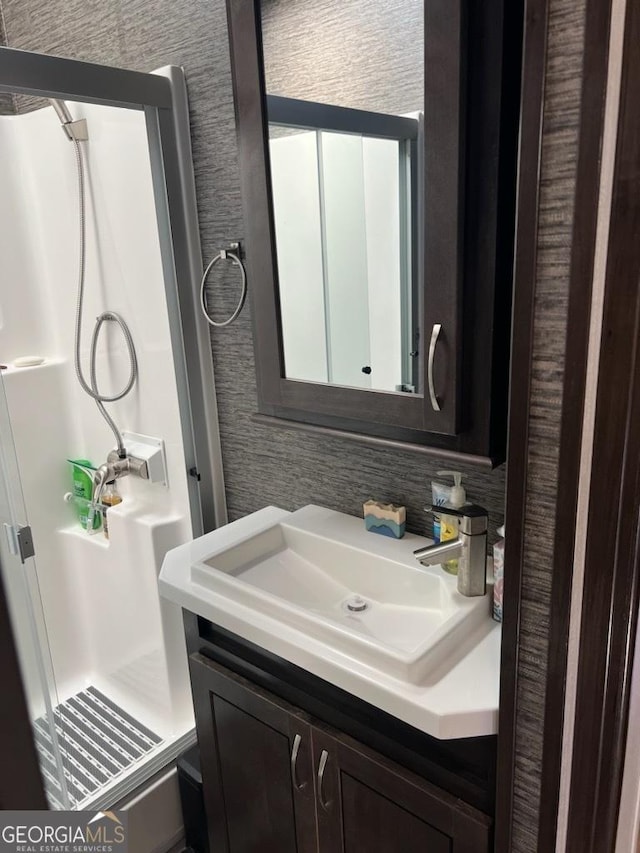 bathroom with vanity and walk in shower