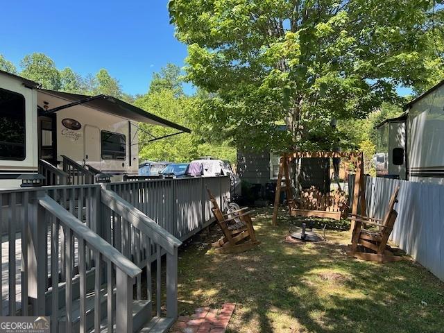 view of yard featuring a wooden deck