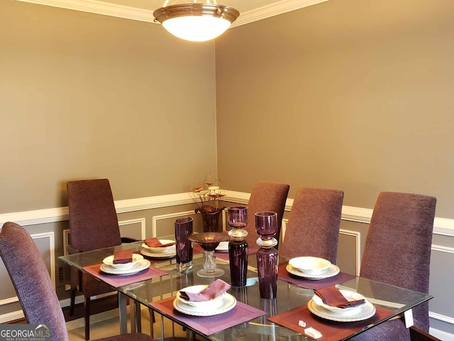 dining area featuring crown molding