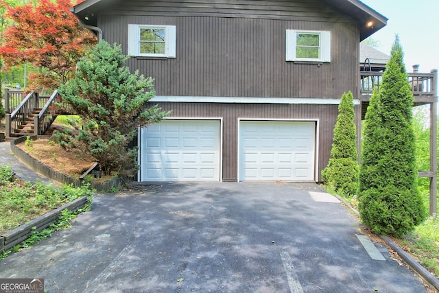 view of side of home with a garage