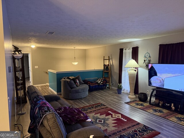 living room featuring hardwood / wood-style floors and a wealth of natural light