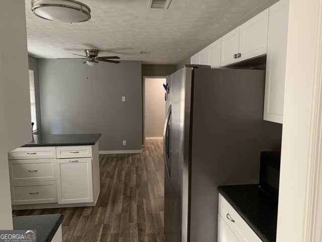 kitchen featuring white cabinets, appliances with stainless steel finishes, dark hardwood / wood-style floors, and sink