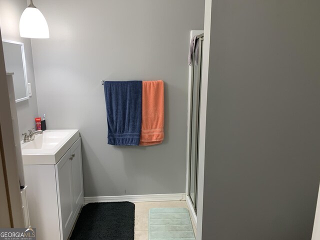 bathroom with a shower with shower door and toilet