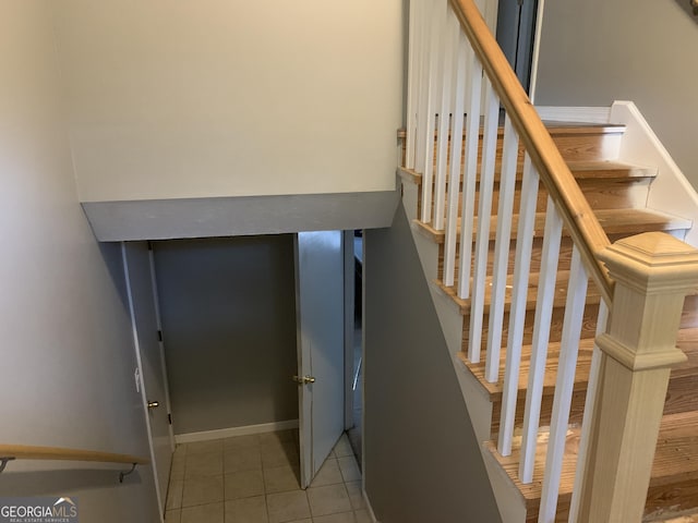 staircase with tile patterned flooring