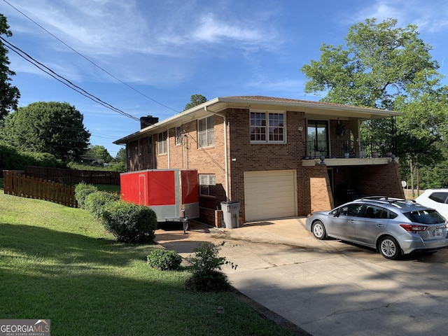 view of front of property featuring a garage and a front yard