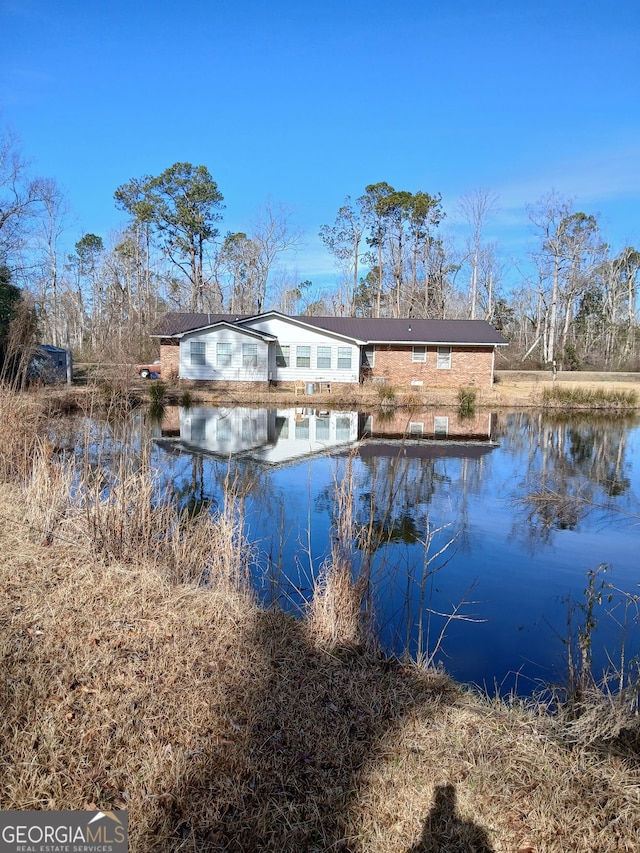 exterior space with a water view