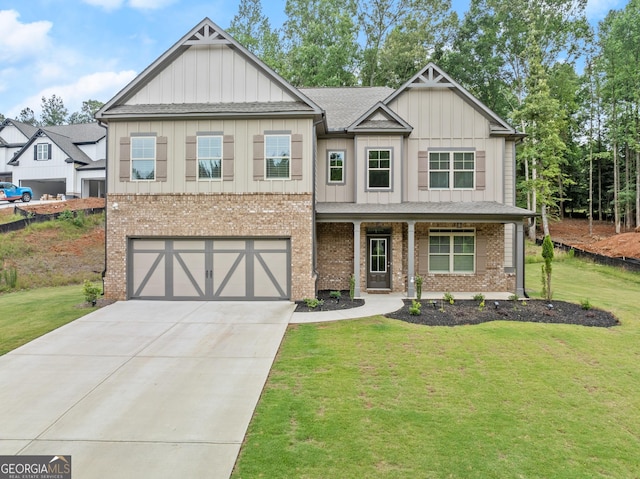 craftsman house featuring a front yard and a garage