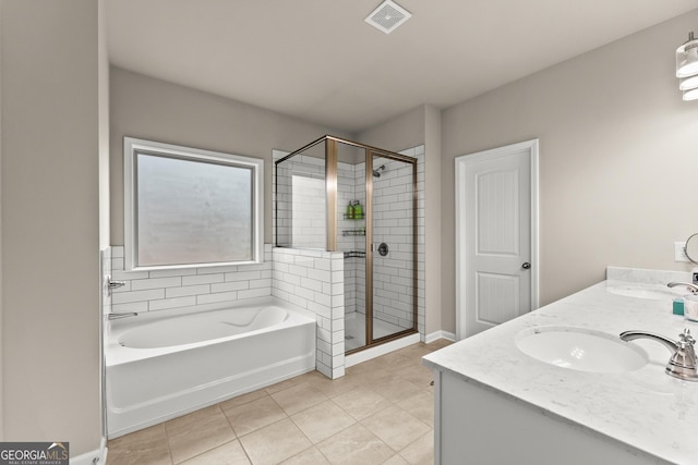 bathroom with tile patterned flooring, vanity, and independent shower and bath