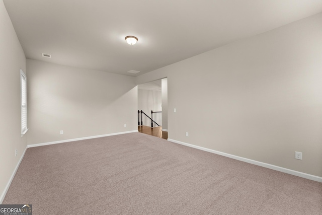 spare room with carpet