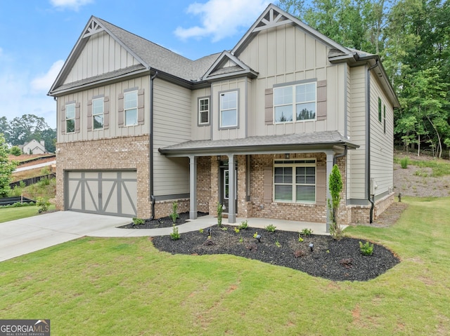 craftsman inspired home with covered porch, a garage, and a front yard