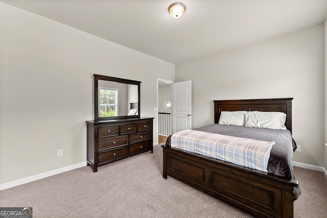 bedroom featuring light carpet