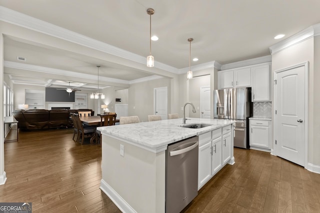 kitchen with ceiling fan, sink, an island with sink, white cabinets, and appliances with stainless steel finishes