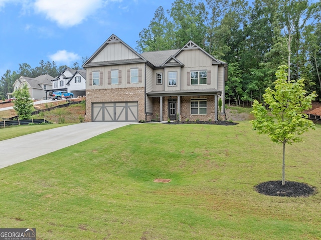 view of front facade with a front yard and a garage