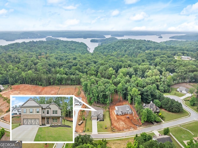 birds eye view of property featuring a water view