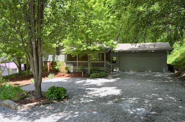 view of front of house featuring a garage and a porch