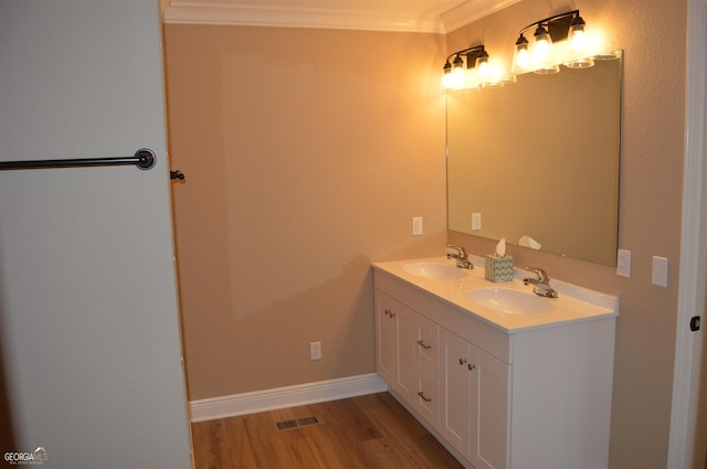 bathroom with vanity and wood-type flooring